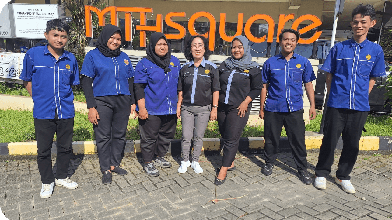 Team photo with employees in blue uniforms